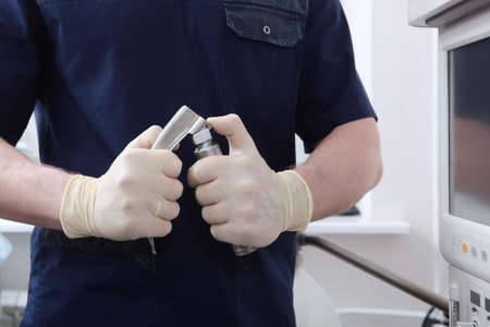 An anesthesiologist with a laryngoscope in his hands.Tracheal intubation. Preparation of equipment...