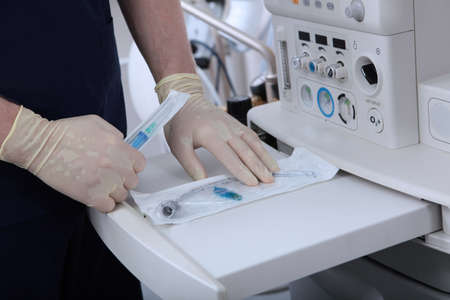 Pull-out panel on ventilator to accommodate medical devices. Sterile sealed bag with tracheostomy...