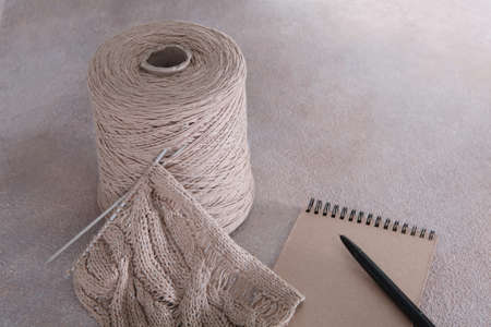 Multicolored cotton yarn for hand knitting.Tangle stand.Vertical photo.Top view.Copy space.