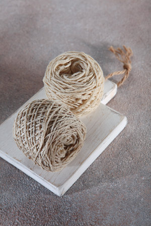 Multicolored cotton yarn for hand knitting.Tangle stand.Vertical photo.Top view.Copy space.