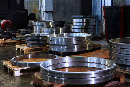 Large diameter bearings. Finished products of the bearing plant. Large number of large bearings. Heavy industry concept.の写真素材