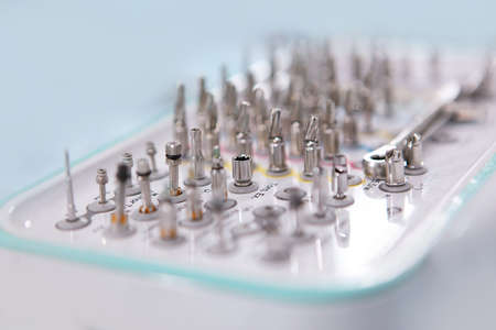 Dental instruments for installing implants close-up. Out of focus. Modern dentistry. Free space or background.の写真素材
