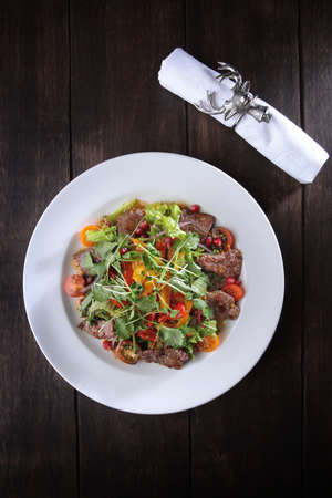 Seafood salad in cheese sauce. Flat lay.Top view.Copy space. Menu for a restaurant or cafe.Vertical photo.Festive serving.の写真素材