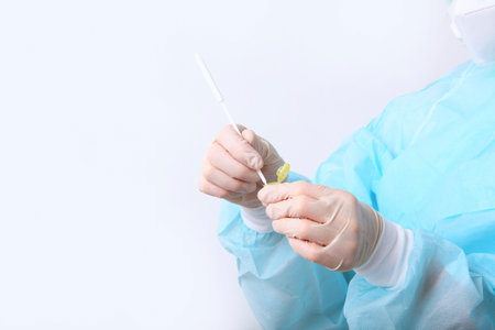 A syringe in the hands of a nurse. Taking tests in a medical laboratory. Hands in protective gloves...