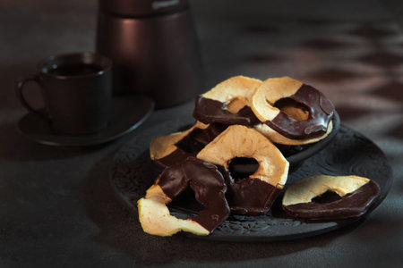 Apple dried fruits in chocolate.Vertical photo.Healthy food. Dessert without sugar.の写真素材