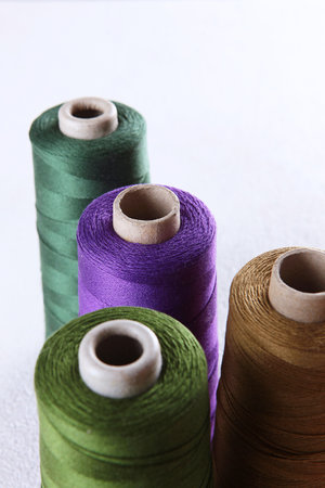 Multicolored cotton yarn or thread on coils. Multicolored yarn.Skind of thread.Texture of multicolored threads in coils.の写真素材