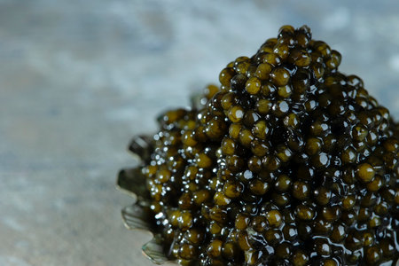 Black caviar. Macrophotography. A delicacy on a neutral background. Copy space.の写真素材