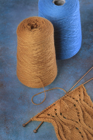 Wool yarn in bobbins. A sample is linked. The spokes are made of bamboo. Skeins of yarn for...