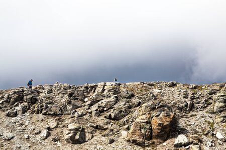 Lonely tourists walking in Switzerland mountains national parkの写真素材