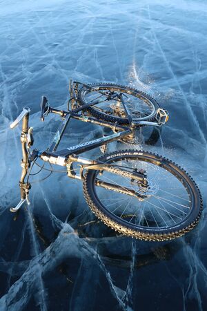 Bicycle in the middle of iced Baikal lakeの写真素材