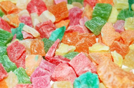 A pile of colorful candied fruits on white backgroundの写真素材