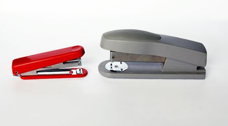 confrontation staplers on a white backgroundの写真素材