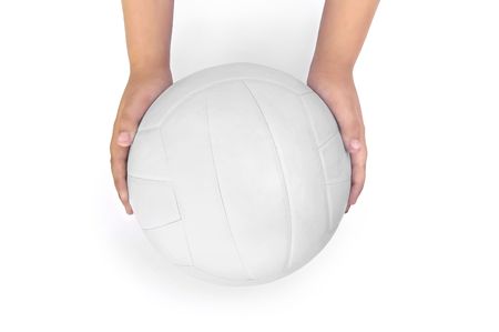 White volleyball in the hands of a child isolated on white backgroundの写真素材