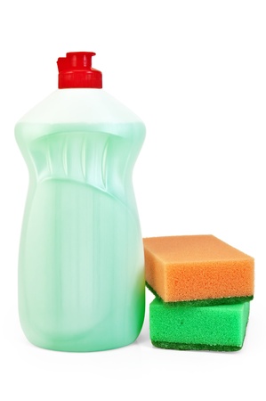 Green bottle with detergent and two sponges isolated on white backgroundの写真素材
