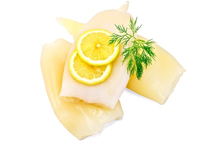 Three prepared cleaned squid with lemon and dill isolated on white backgroundの写真素材