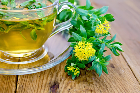Herbal tea and Rhodiola rosea on boardの写真素材