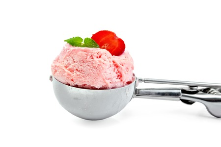 Strawberry ice cream with mint in a special metal spoon isolated on white backgroundの写真素材