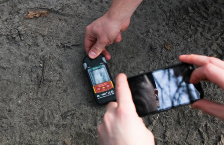 Pripyat, Ukraine - February 15, 2014: Measurement of radiation levels by the gegger counter. Pripyat is an exclusion zone after the Black Andbult nuclear disaster at the nuclear power plant.のeditorial素材