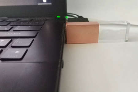 Flash drive inserted into the laptop. Data transmission technologies.