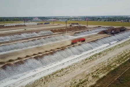 Unloading and loading of crushed stone in the warehouses of the quarry. Building materials.