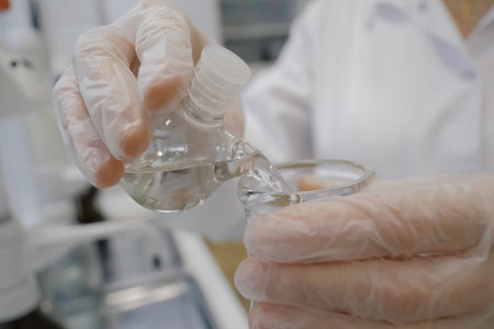 Pouring the solution into a test tube. Laboratory tests.