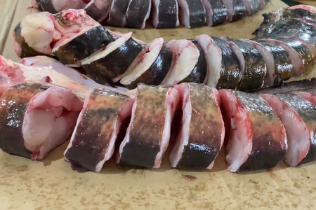 Fish steaks on the counter. Raw fish cut into pieces.
