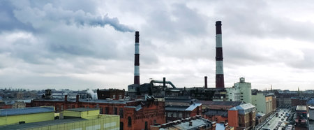 tall chimneys of boiler houses that heat the city.の写真素材