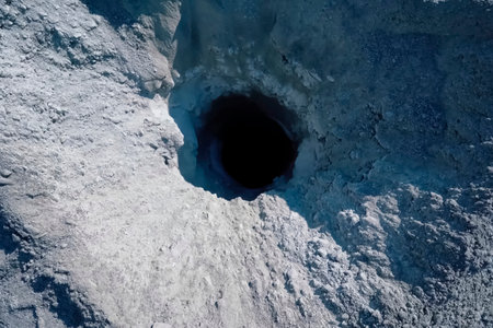 Wellhead of a drilled well in a rockの写真素材