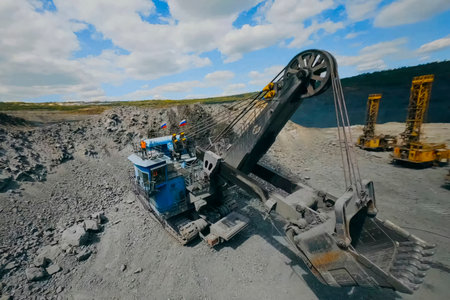 Large mining excavator with bucket in the quarry.