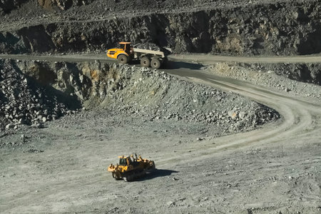 Dump trucks in a gold ore quarry