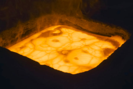 Molten gold pours out of the crucible
