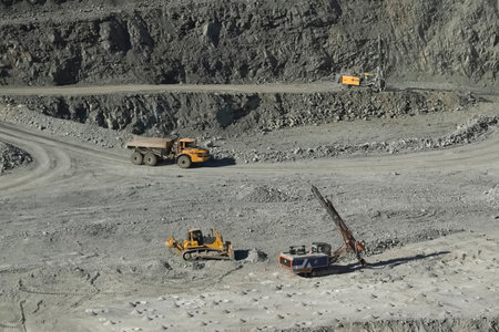 Dump trucks in a gold ore quarry