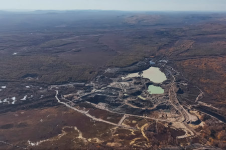 An active gold mining quarry with industrial equipment
