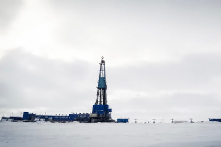 DRILLING RIG in the middle of the tundra, snowy landscapeの写真素材