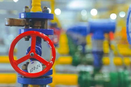 Valves and gas meters in the gas metering room in the gas pipeline at the LNG plantの写真素材