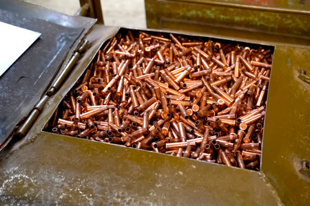 Warehouse of crimped cartridge cases, ammunition production.