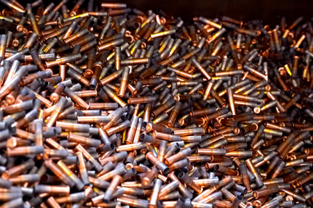 Large pile of annealed cartridge cases, storage of components in ammunition production process.