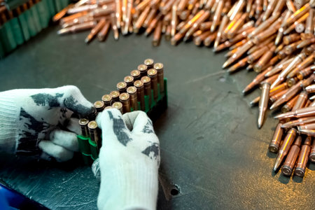 Assembling finished cartridges into transport cases, firearms production.の写真素材