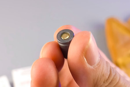 Construction cartridges for construction pistol in male hand.の写真素材