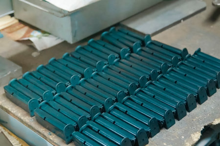A lot of neatly stacked pistol magazines, the production of weapons and ammunition