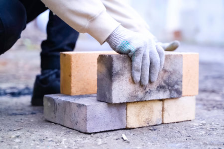 Building a fire pit structure from fireproof bricks.の写真素材