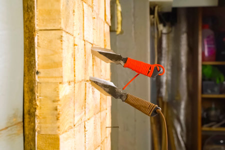 Throwing knives stuck in throwing knife board.の写真素材