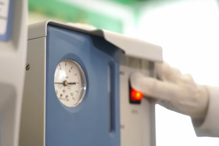 The start button is red next to the pressure gauge. Compressor start-up panel at LNG station, gas industrial plant.の写真素材