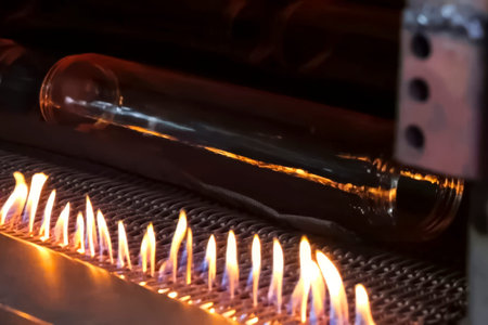 Melting glass from recycled materials, heating glass on fire.の写真素材