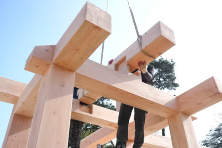 Assembly of a frame house from polished beams with cut fitted joints-puzzles.