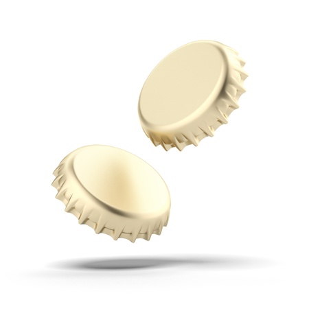 Two golden bottle caps isolated on a white backgroundの写真素材