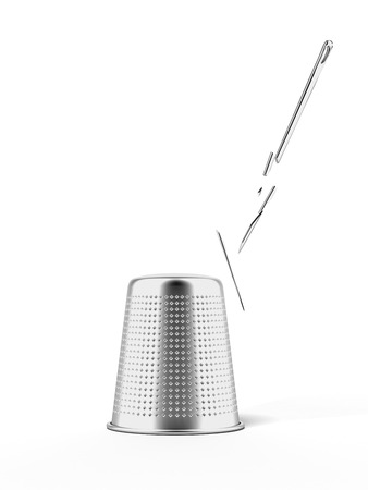 thimble and broken needle isolated on a white backgroundの写真素材