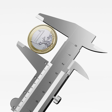 measuring a one euro coin isolated on a white backgroundの写真素材