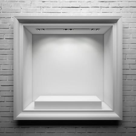 showcase with white stand and frame on the brick wallの写真素材