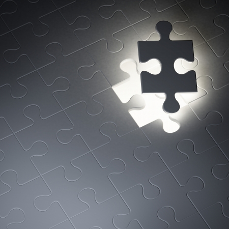 Missing jigsaw puzzle piece in the darkの写真素材